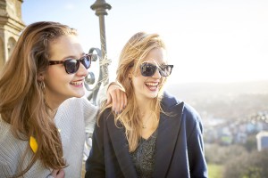 Two young women wearing Snaps sunglasses outside
